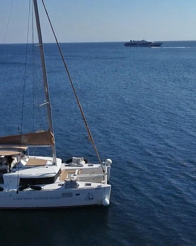 Arial view of Santorini Yachting Catamaran sailing around Santorini
