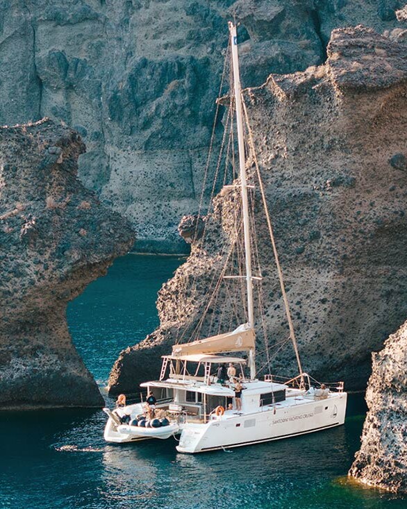 Catamaran anchored by the Indian Rocks in Santorini